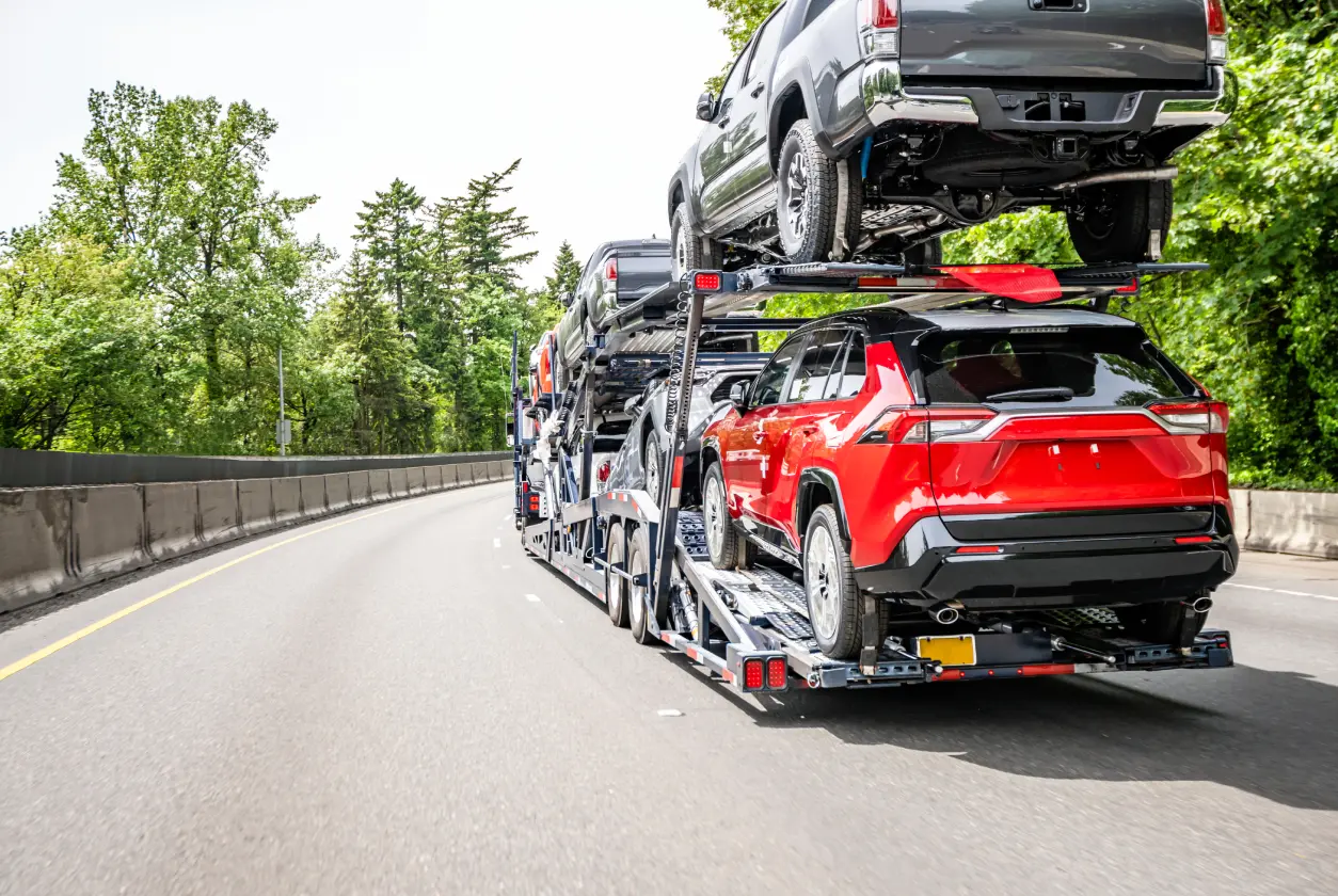 New Project (7) Car transporter on highway with multiple vehicles.